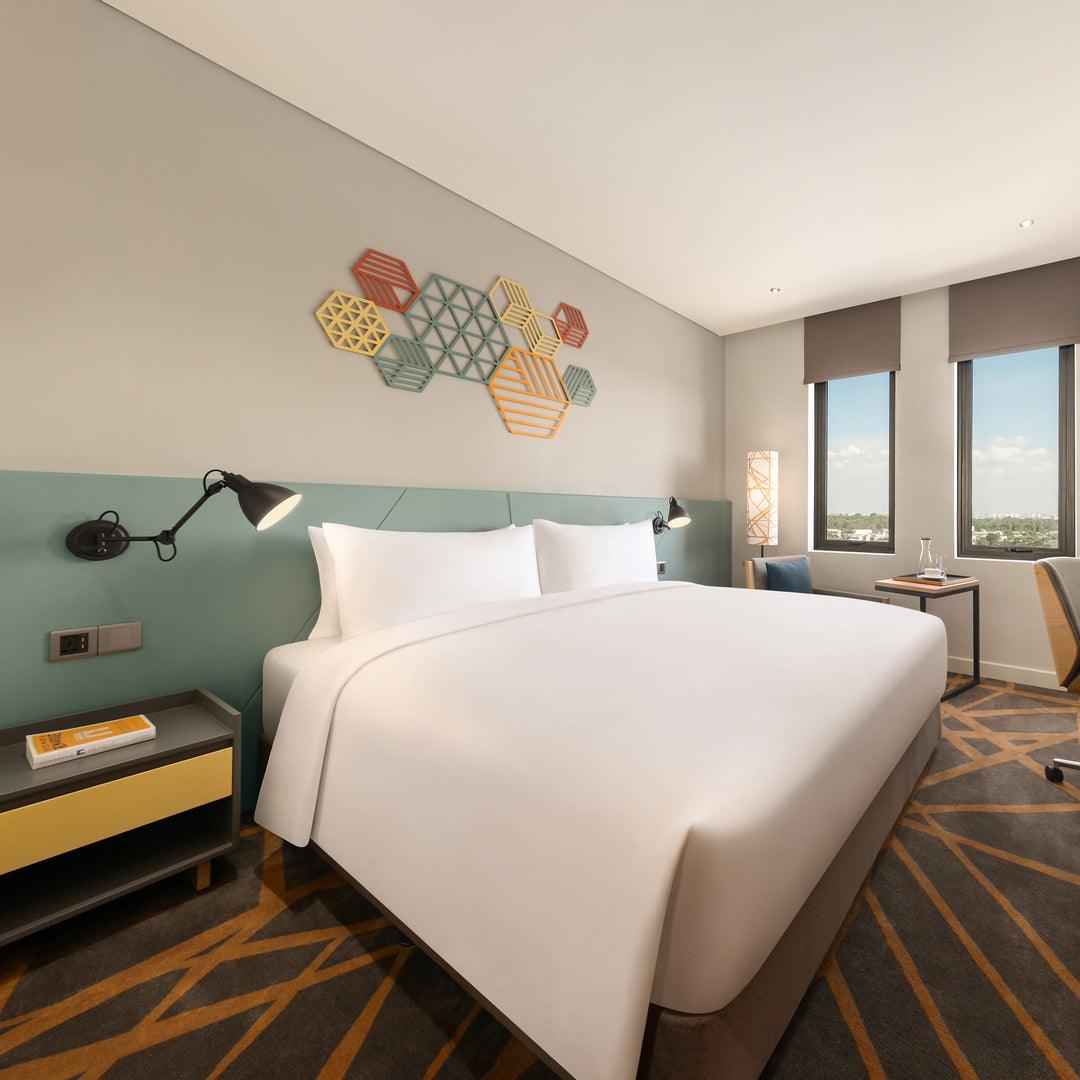 The Hiive Hotel Binh Duong project completion announcement. The image showcases the hotel's branding, signage, and interior decoration, highlighting the exceptional craftsmanship and dedication of the team involved in the project.