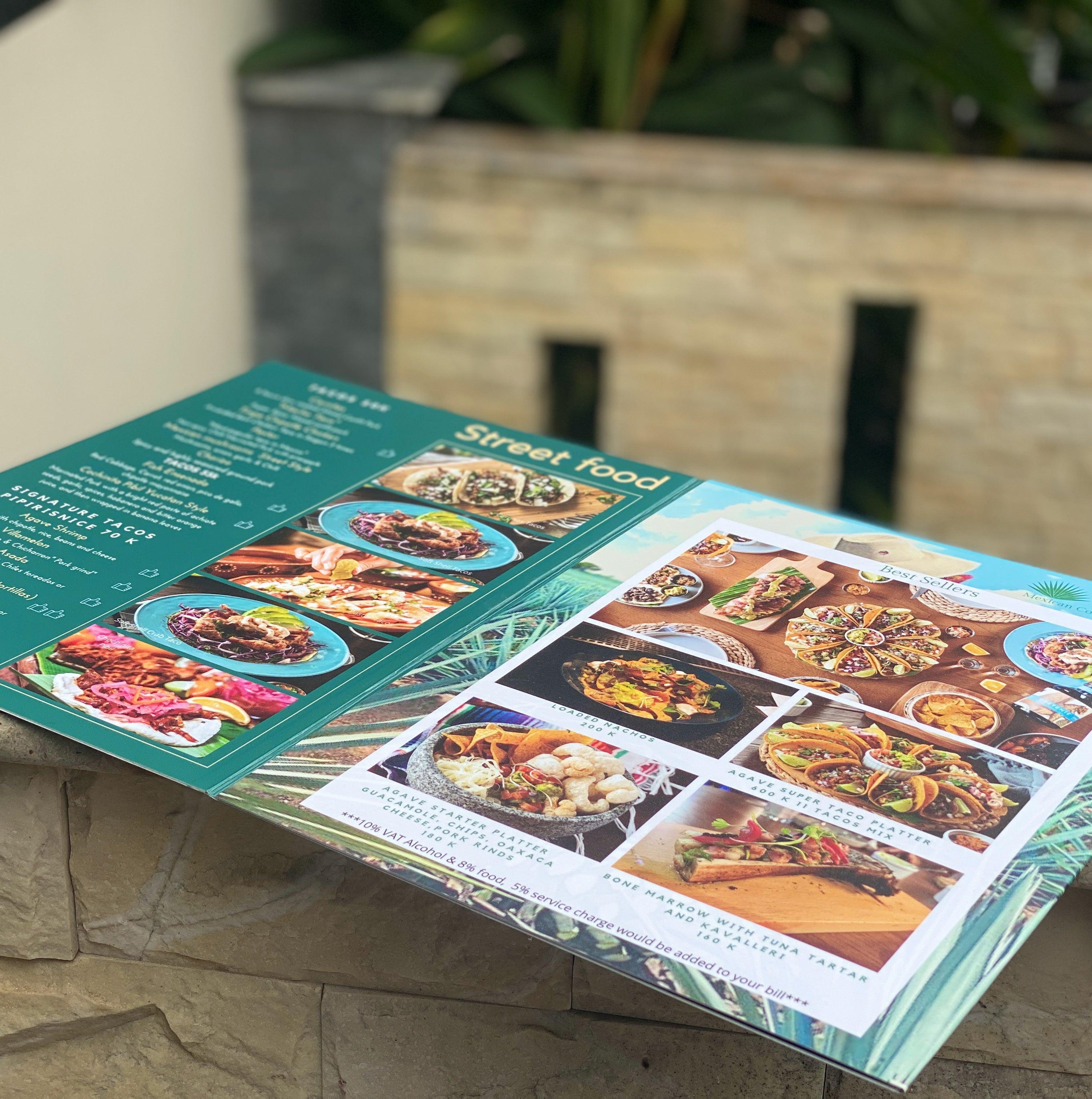 Alt Text: Waterproof menu made of durable 1mm thick plastic PVC with a zigzag fold, designed for easy opening and closing. The menu is clear, long-lasting, and resistant to color changes when exposed to water. It includes a hanging feature for convenient customer viewing.