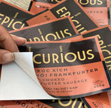 Image showing a variety of custom-printed labels and stickers from ArrowPrint.ca. The labels feature vivid, sharp designs in different shapes, including circles and unique contours. The image highlights the high-quality printing and customization options available, suitable for both small and large orders. ArrowPrint.ca offers worldwide delivery, ensuring your custom labels and stickers are delivered quickly and securely.