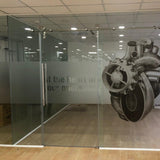 Office glass door with a custom frosty decal featuring a company logo, installed by Arrowprint.ca. The decal adds a professional touch to the workspace. Contact print@arrowprint.ca for personalized quotes and services.